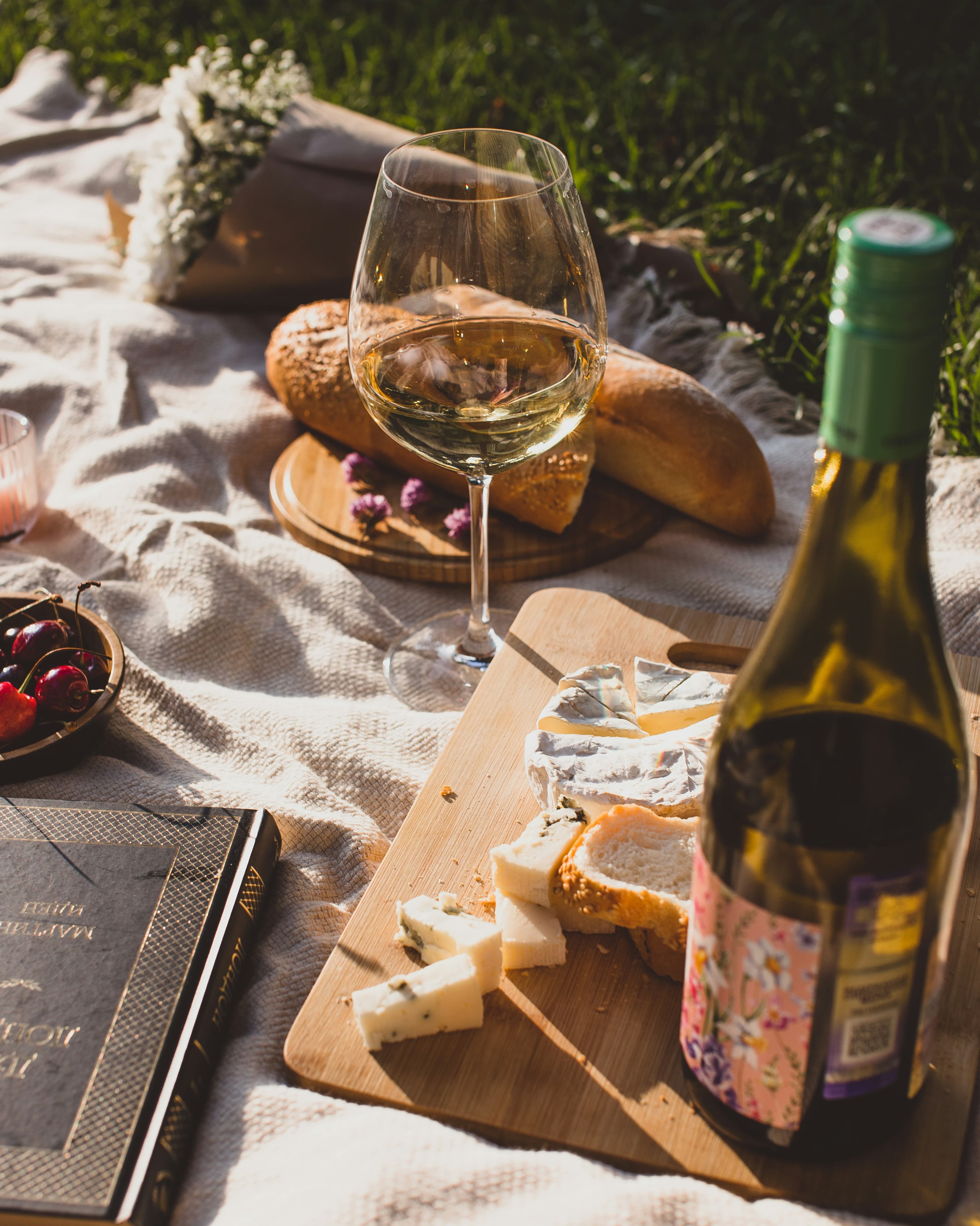 Glass of white wine with bread and cheese